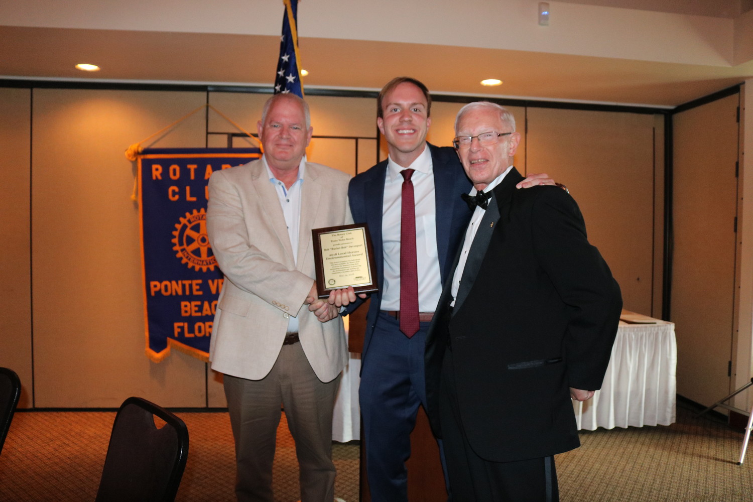 “Bucket” Bob Davenport (left) receives the Environmental Award from Ponte Vedra Recorder Editor Jon Blauvelt (center) and Rotarian Chuck Day (right) at the Local Heroes Awards on May 24.